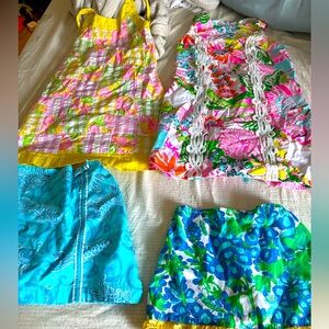 2 Lilly Pulitzer skirts and 2 Lilly Pulitzer dresses.  No stains or tears size 5